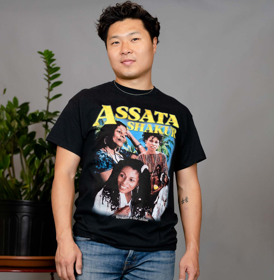 David Chung wearing Assata Shakur t-shirt at public event
