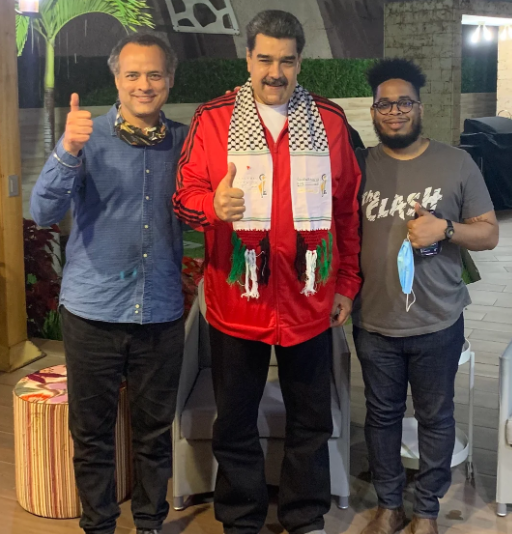 Manolo De Los Santos, Vijay Prashad, and Venezuelan President Nicolás Maduro giving thumbs up